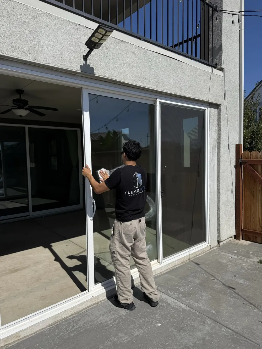 A ClearEdge installer setting a patio door.